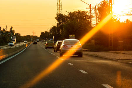 Car traffic at rush hour. Traffic jam, cars on the road at sunset in Bucharest, Romania, 2021のeditorial素材