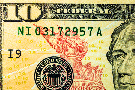 Selective focus on detail of USD banknotes. Close up macro detail of United States Dollars...