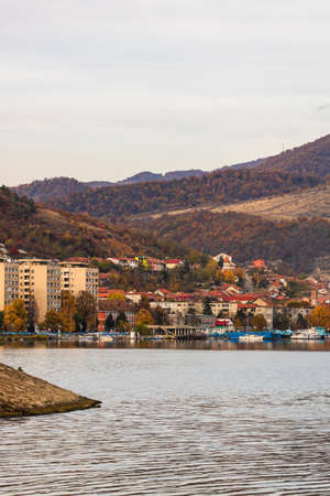 View of Danube river and Orsova city vegetation and buildings, waterfront view. Orsova, Romania, 2021のeditorial素材