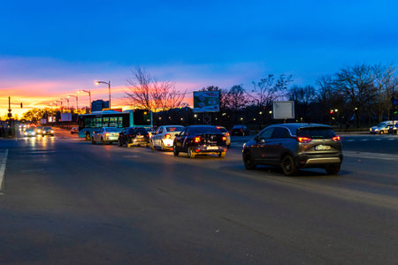 Cars in traffic at rush hour in downtown area of the city. Car pollution, traffic jam in the morning...