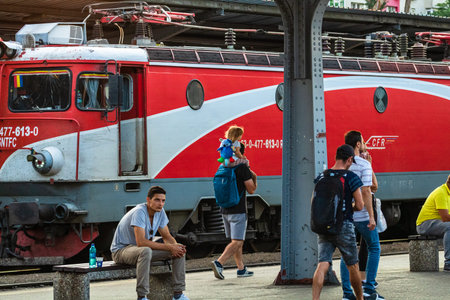 Travelers and commuters waiting for a train on the train platform of Bucharest North Railway Station (Gara de Nord Bucharest) in Bucharest, Romania, 2022のeditorial素材