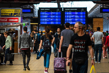 Travelers and commuters waiting for a train on the train platform of Bucharest North Railway Station...