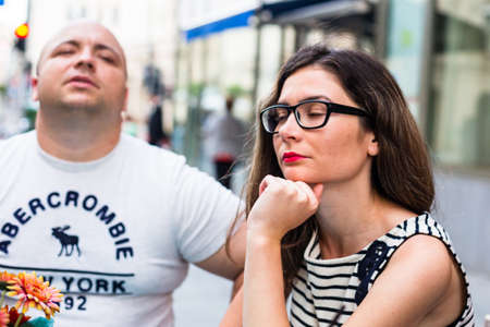 Young couple at restaurant table socializing in Bucharest, Romania, 2022のeditorial素材