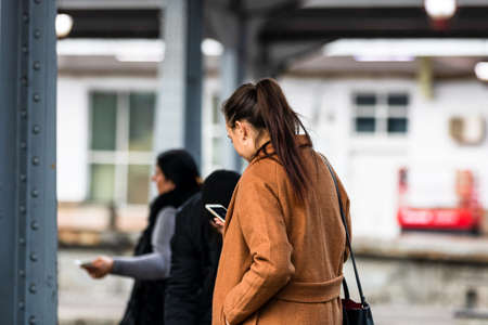 Travelers and commuters waiting for a train on the train platform of Bucharest North Railway Station (Gara de Nord Bucharest) in Bucharest, Romania, 2022のeditorial素材