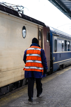 Train crew man doing checkings on the platform at the Bucharest North Railway Station in Bucharest,...
