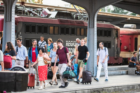 Travelers and commuters waiting for a train on the train platform of Bucharest North Railway Station (Gara de Nord Bucharest) in Bucharest, Romania, 2022のeditorial素材