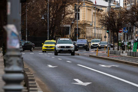 Car traffic at rush hour in downtown area of the city. Car pollution, traffic jam in Bucharest, Romania, 2022のeditorial素材