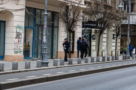 People on the street wearing masks in Bucharest, Romania, 2022