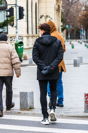 People on the street wearing masks in Bucharest, Romania, 2022のeditorial素材