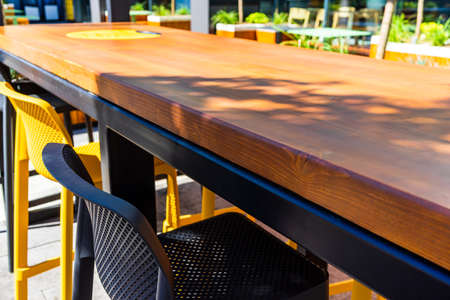 Detail of wooden bench and table on the terraceの写真素材