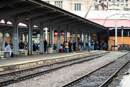 Travelers and commuters waiting for a train on the train platform of Bucharest North Railway Station (Gara de Nord Bucharest) in Bucharest, Romania, 2022のeditorial素材