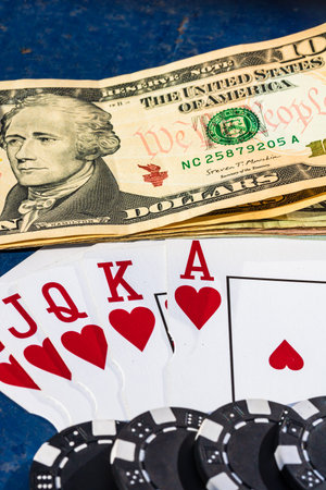 Stacks of poker chips with money and cards