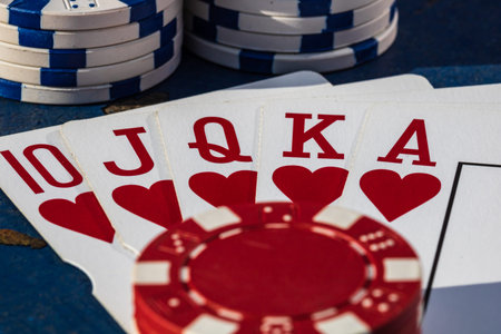 Stacks of poker chips with money and cards