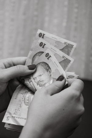 Woman counting money, counting LEI close up