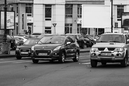 Car traffic, pollution, traffic jam city downtown Bucharest, Romania, 2022