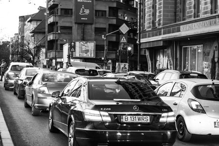 Car traffic, pollution, traffic jam city downtown Bucharest, Romania, 2022