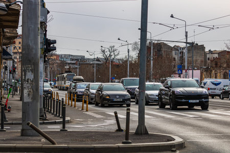 Car traffic at rush hour in downtown area of the city. Car pollution, traffic jam in Bucharest,...