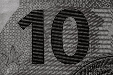 Selective focus on detail of euro banknotes. Close up macro detail of money banknotes, 10 euro...