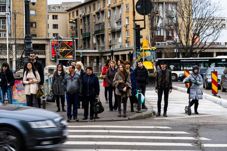 People and tourists wander the streets of the Bucharest Old Town, Romania, 2022のeditorial素材