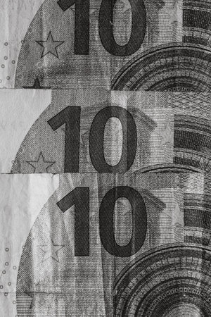 Selective focus on detail of euro banknotes. Close up macro detail of money banknotes, 10 euro...