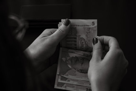 Woman counting money, counting LEI close up