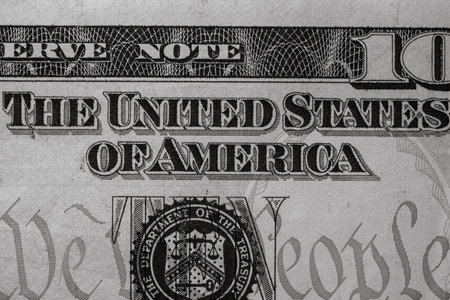 Selective focus on detail of USD banknotes. Close up macro detail of United States Dollars banknotes. World money concept, inflation and economy conceptの写真素材