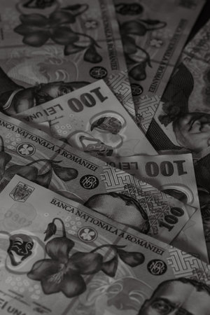 Selective focus on stack of LEI romanian money. Lei banknotes isolated.