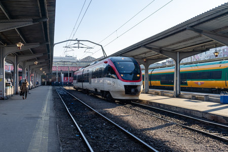 Train in motion or at train platform at North Rail station (Gara de Nord). Train transport infrastructure. Bucharest, Romania, 2023のeditorial素材