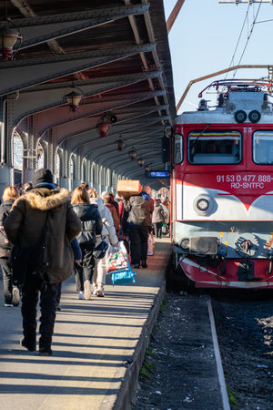 People getting on and off the train at Bucharest North Railway Station (Gara de Nord) in Bucharest, Romania, 2023のeditorial素材