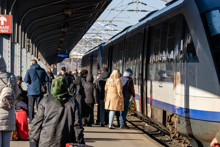 People getting on and off the train at Bucharest North Railway Station (Gara de Nord) in Bucharest, Romania, 2023のeditorial素材