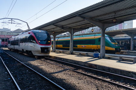 Train in motion or at train platform at North Rail station (Gara de Nord). Train transport infrastructure. Bucharest, Romania, 2023のeditorial素材