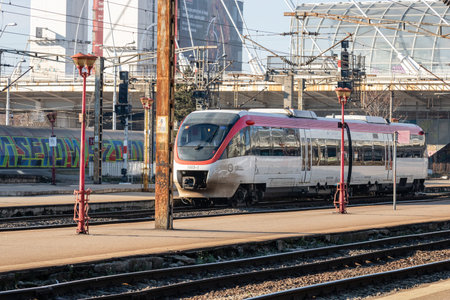 Train in motion or at train platform at North Rail station (Gara de Nord). Train transport...