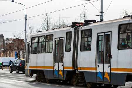 Tram in traffic on the streets of Bucharest, Romania, 2022のeditorial素材