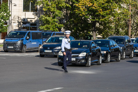 Police agent, Romanian Traffic Police (Politia Rutiera) directing traffic. Rush hour in Bucharest, Romania, 2022のeditorial素材