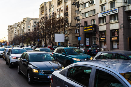 Car traffic at rush hour in downtown area of the city. Car pollution, traffic jam in the morning and evening in the capital city of Bucharest, Romania, 2021のeditorial素材