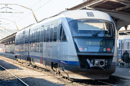 Train in motion or at train platform at North Rail station (Gara de Nord). Train transport infrastructure. Bucharest, Romania, 2023のeditorial素材