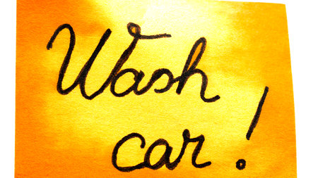 Wash car handwriting text close up isolated on yellow paper with copy space.の写真素材