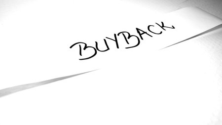 Writing buyback on white label on white background.の写真素材