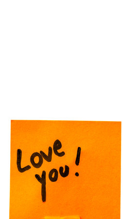 Love you handwriting text close up isolated on orange paper with copy space.の写真素材