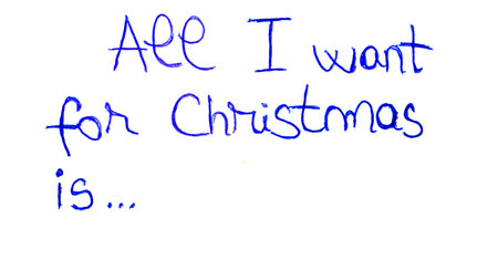 All I want for Christmas handwriting text close up isolated on white paper with copy space. Writing text on memo post reminderの写真素材