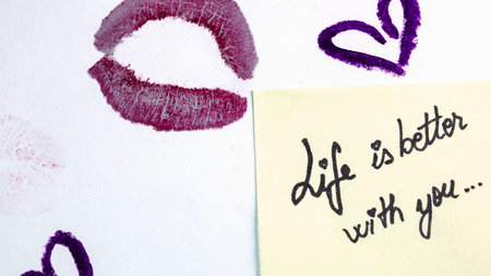 Valentine`s day concept. Lipstick kiss. Writing and drawing with lipstick. Life is better with you.