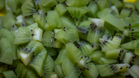 Ripe kiwi fruit. Detail of chopped exotic kiwi fruits used for dessertsの写真素材
