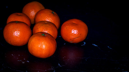 Detail of orange fruit on black backgroundの写真素材