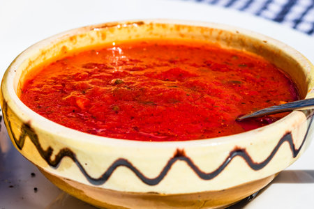 Close up of traditional rustic bowl with homemade tomatoes sauce.の写真素材