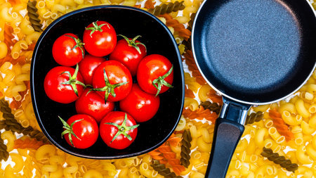 Beautiful tasty Italian pasta, tomatoes, onions and garlic for cooking pastaの写真素材
