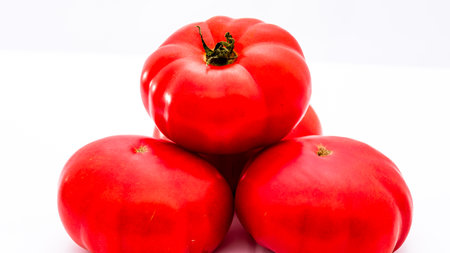 Fresh and tasty ripe red tomatoes isolatedの写真素材