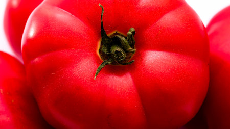 Fresh and tasty ripe red tomatoes isolatedの写真素材