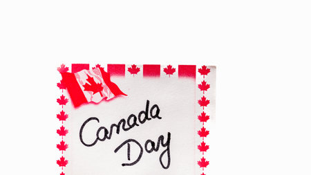 Canada day handwriting on paper with Canada flag. Writing text on memo post reminder.の写真素材
