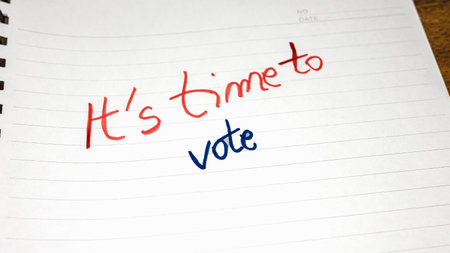 It`s time to vote, handwriting  text on paper, political message. Political text on office agenda. Concept of democracy, voting, politics. Copy space.の写真素材
