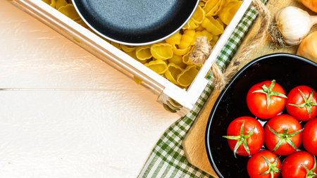 Beautiful tasty Italian pasta, tomatoes, onions and garlic for cooking pastaの写真素材